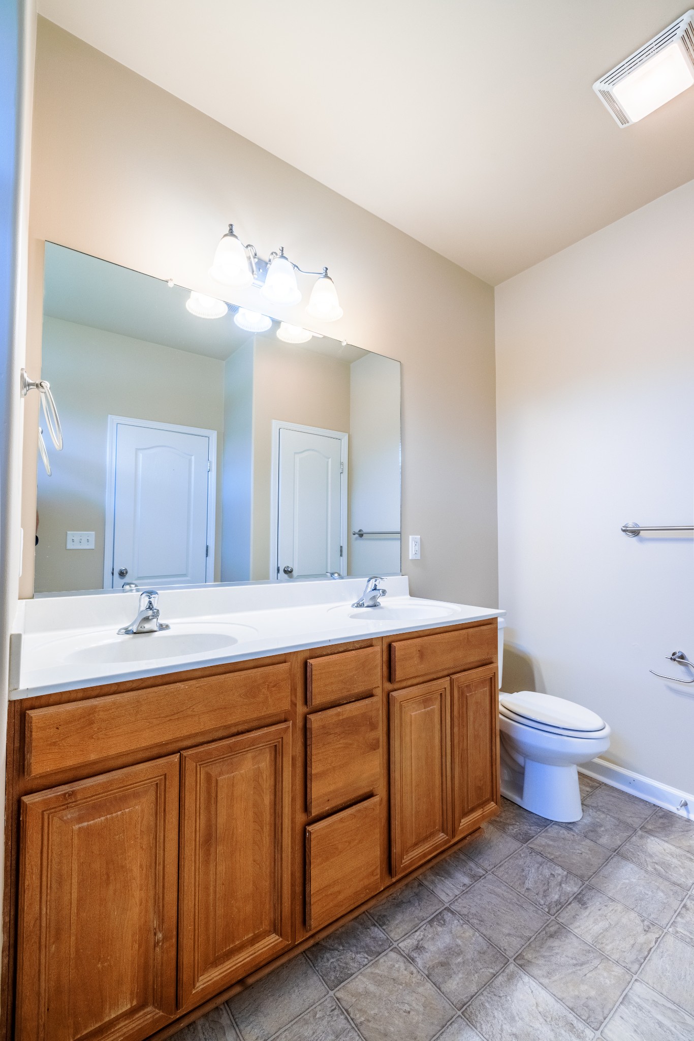 3799 Willow Creek Road Nashville, TN 37207 - Photo 14 of 25 a bathroom with a double vanity sink mirror and toilet