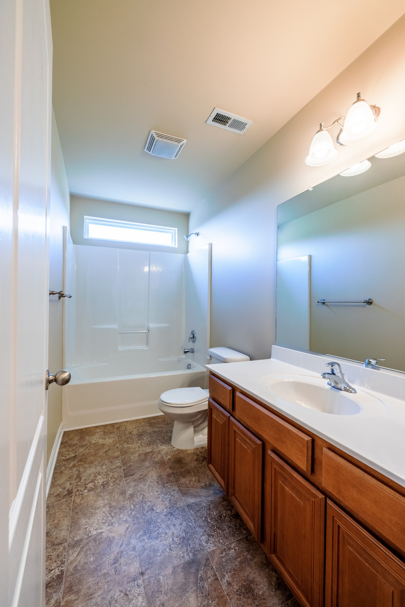 3799 Willow Creek Road Nashville, TN 37207 - Photo 17 of 25 a bathroom with a double vanity sink toilet mirror and bathtub