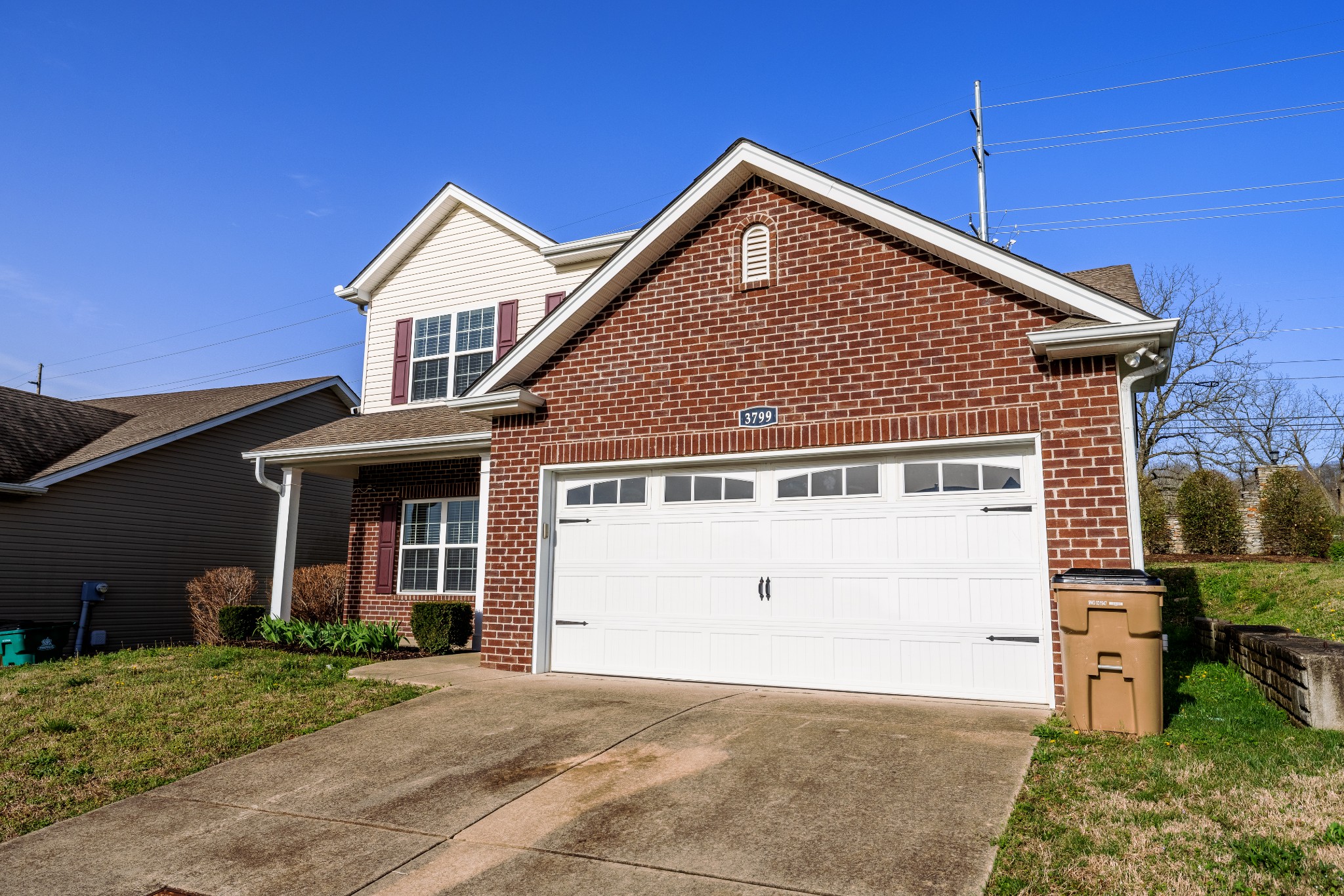 3799 Willow Creek Road Nashville, TN 37207 - Photo 2 of 25 a front view of a house with a yard and garage