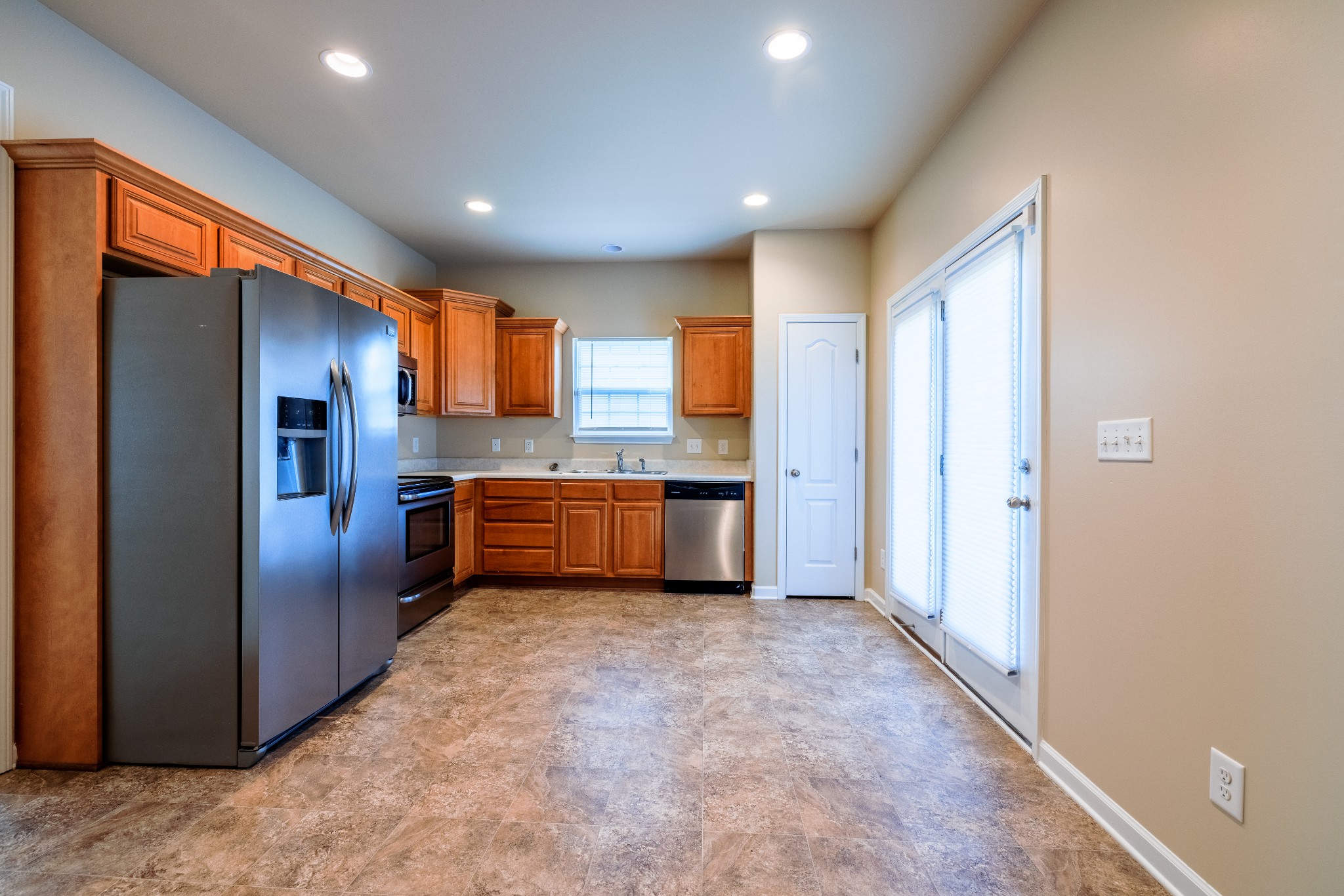 3799 Willow Creek Road Nashville, TN 37207 - Photo 3 of 25 a kitchen with stainless steel appliances granite countertop a refrigerator a sink a stove and oven