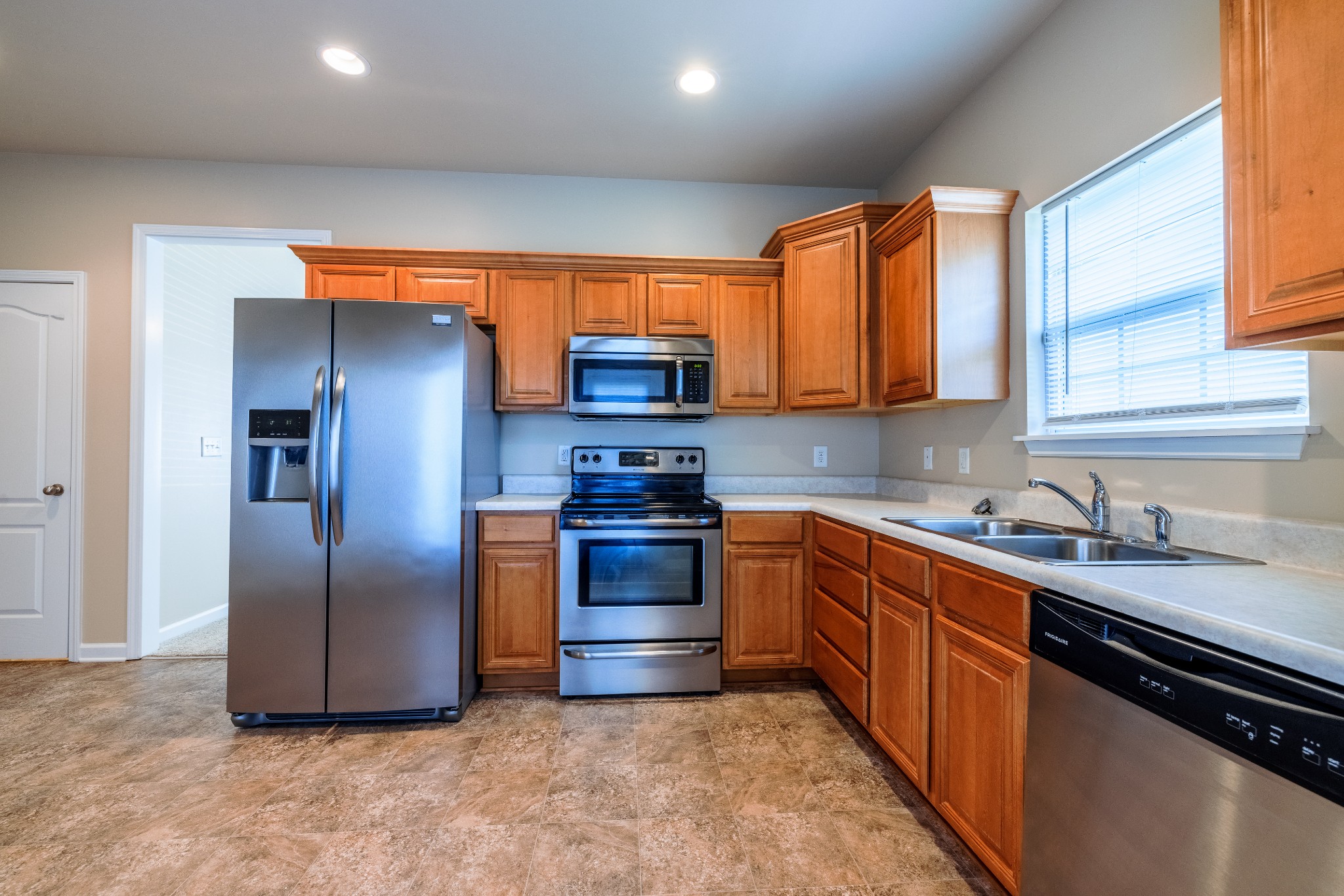 3799 Willow Creek Road Nashville, TN 37207 - Photo 4 of 25 a kitchen with stainless steel appliances granite countertop a stove a sink a refrigerator and a microwave