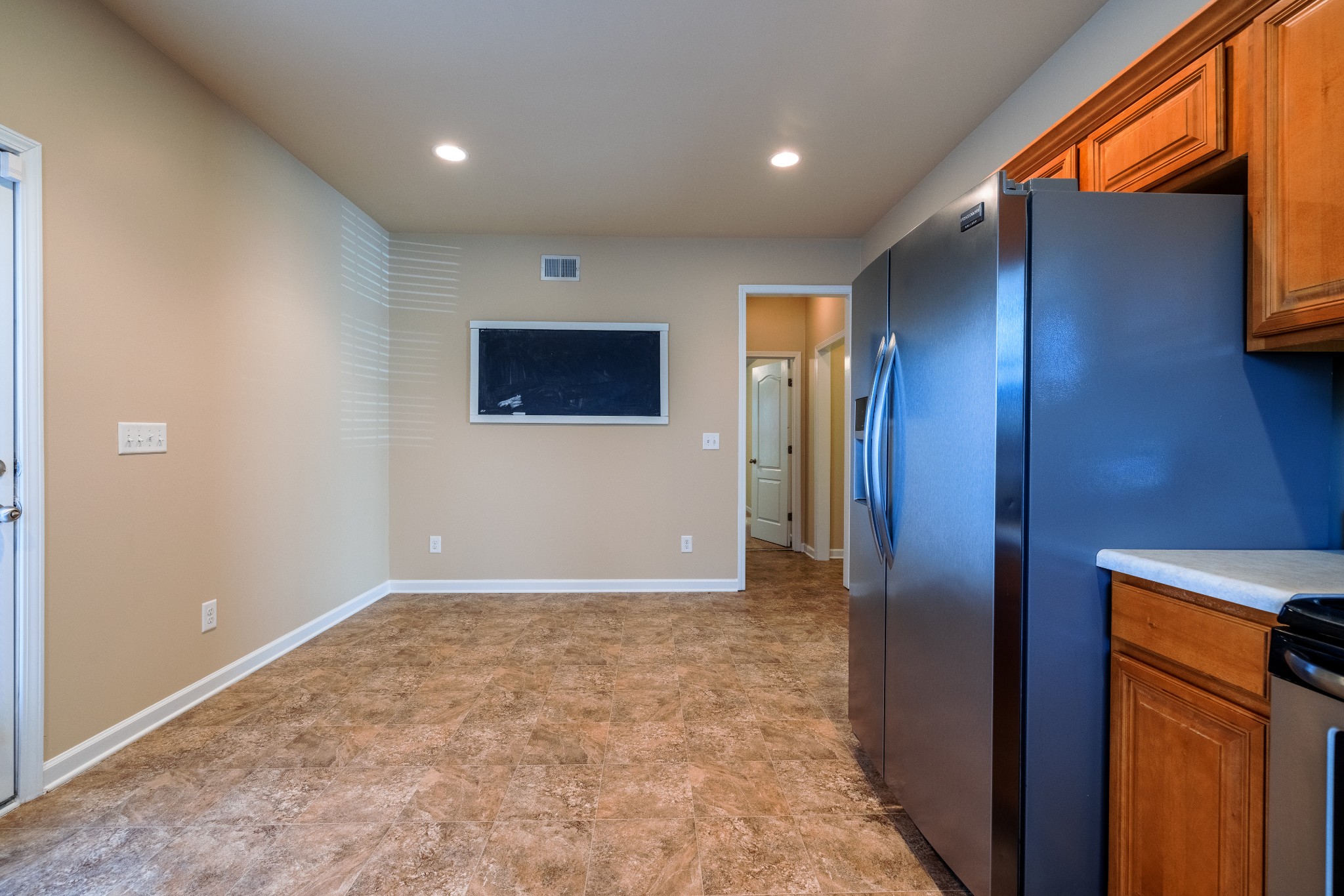 3799 Willow Creek Road Nashville, TN 37207 - Photo 5 of 25 a view of an empty room with wooden floor and a window