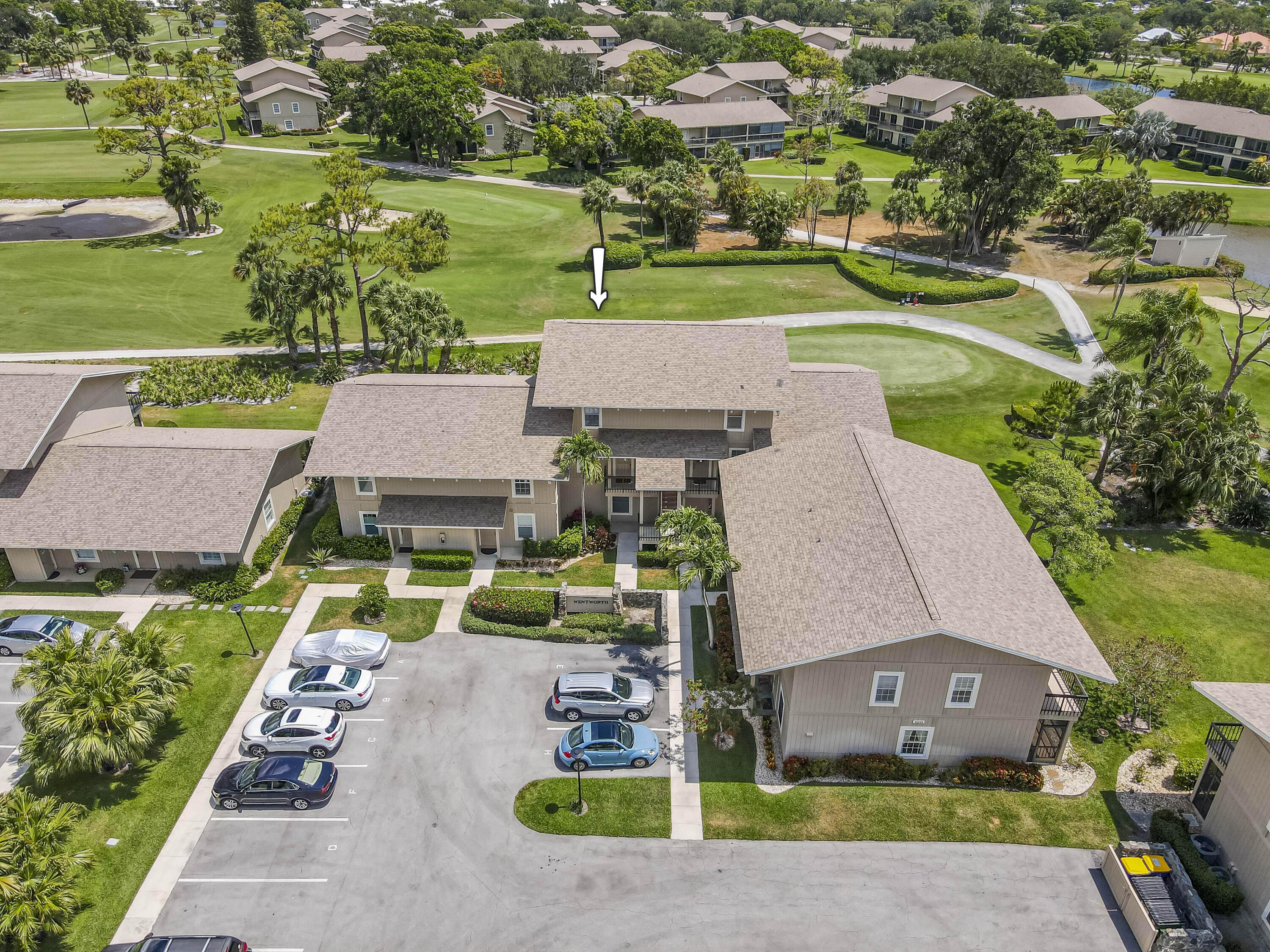 9239 Southeast Riverfront Terrace, Unit D Jupiter, FL 33469 - Photo 21 of 33 an aerial view of a house with a garden and lake view