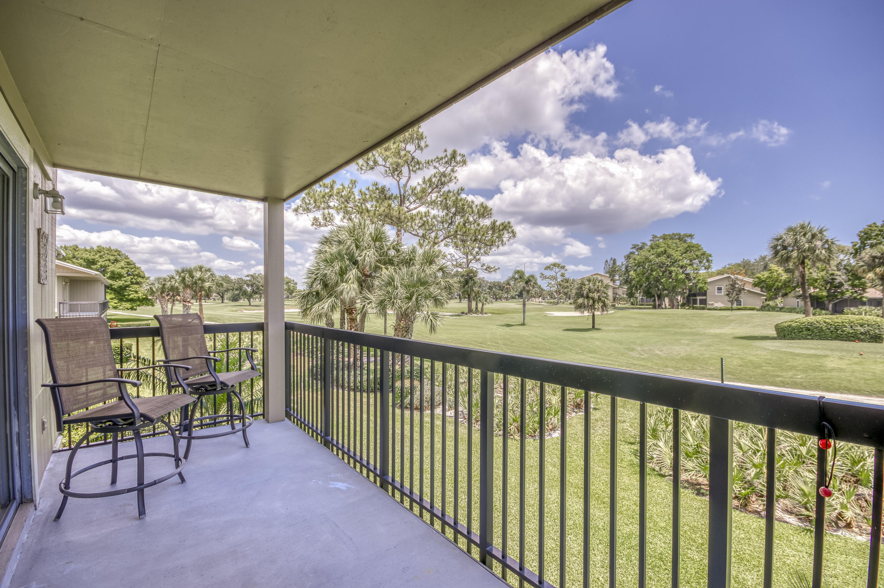 9239 Southeast Riverfront Terrace, Unit D Jupiter, FL 33469 - Photo 6 of 33 a view of balcony with furniture