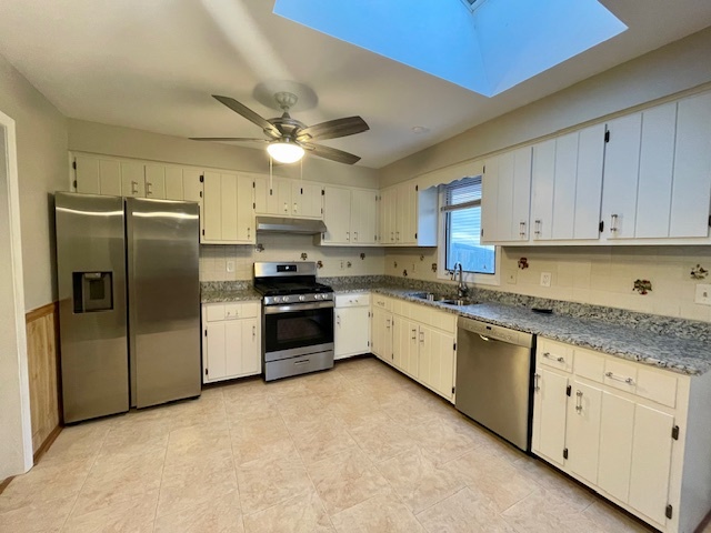 355 Pearson Circle Naperville, IL 60563 - Photo 5 of 19 a kitchen with granite countertop a refrigerator a sink a stove and cabinets