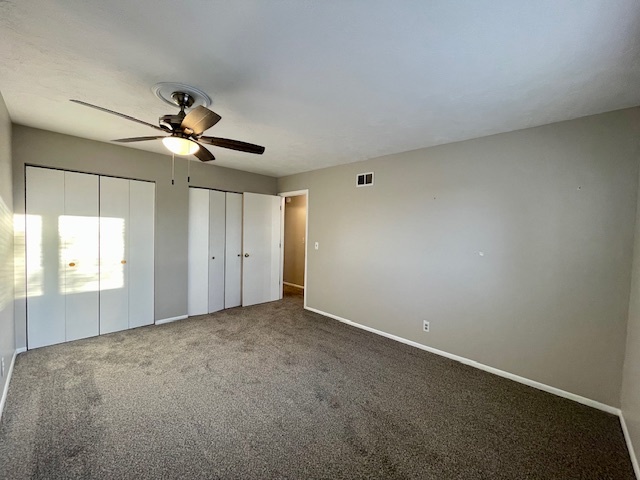 355 Pearson Circle Naperville, IL 60563 - Photo 10 of 19 an empty room with windows and fan