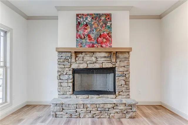 a bathroom with a granite countertop sink vanity mirror and toilet