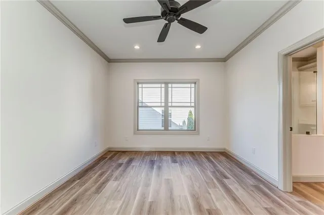 a bathroom with a granite countertop double vanity sink a mirror a vanity and a shower