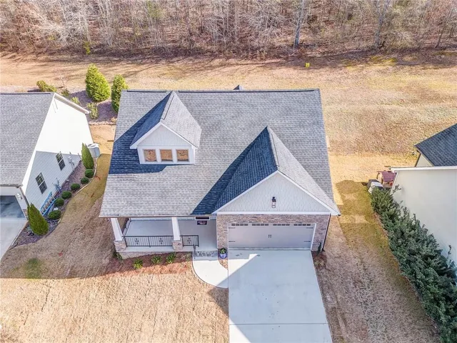 an aerial view of a house with swimming pool