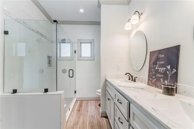 a kitchen with stainless steel appliances granite countertop a refrigerator sink and stove