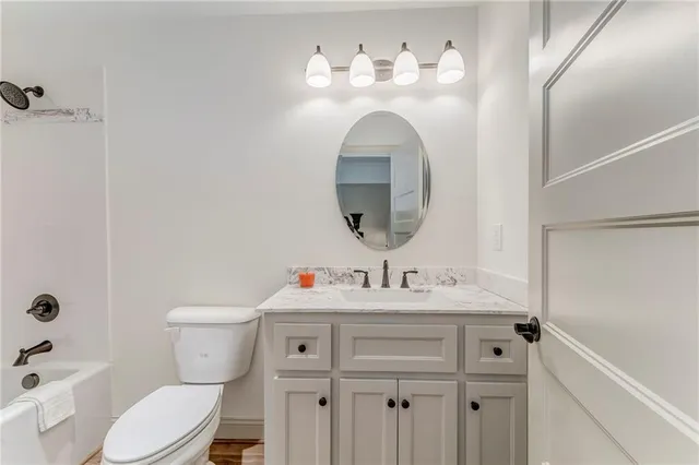 an aerial view of a house with a yard swimming pool and mountain view