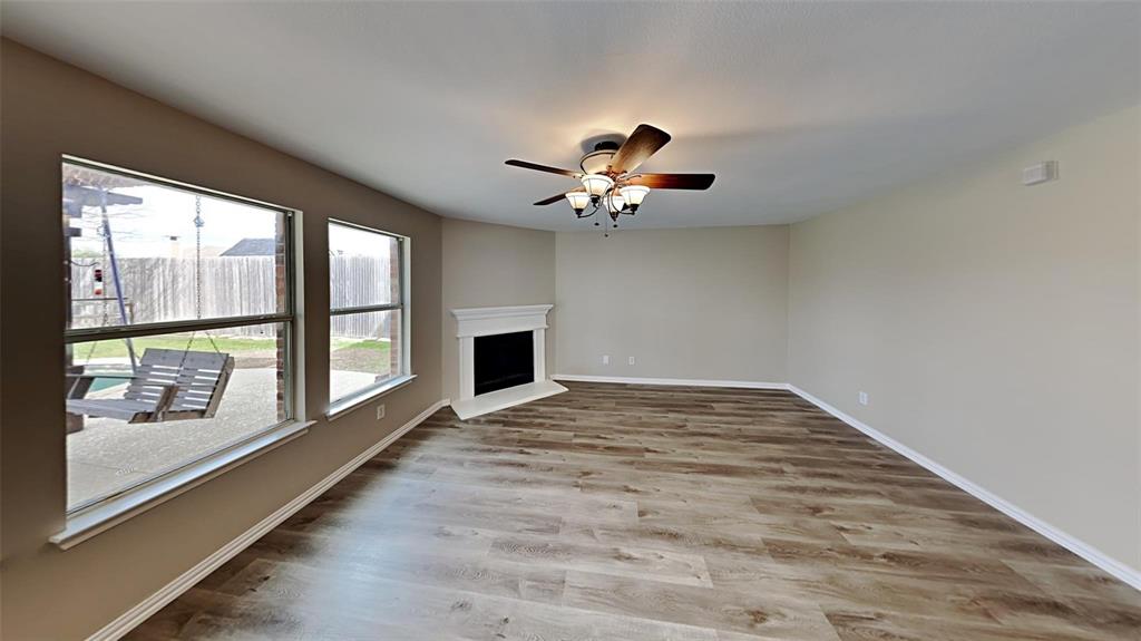 2203 Wagon Wheel Trail Corinth, TX 76208 - Photo 4 of 16 a view of an empty room with a window