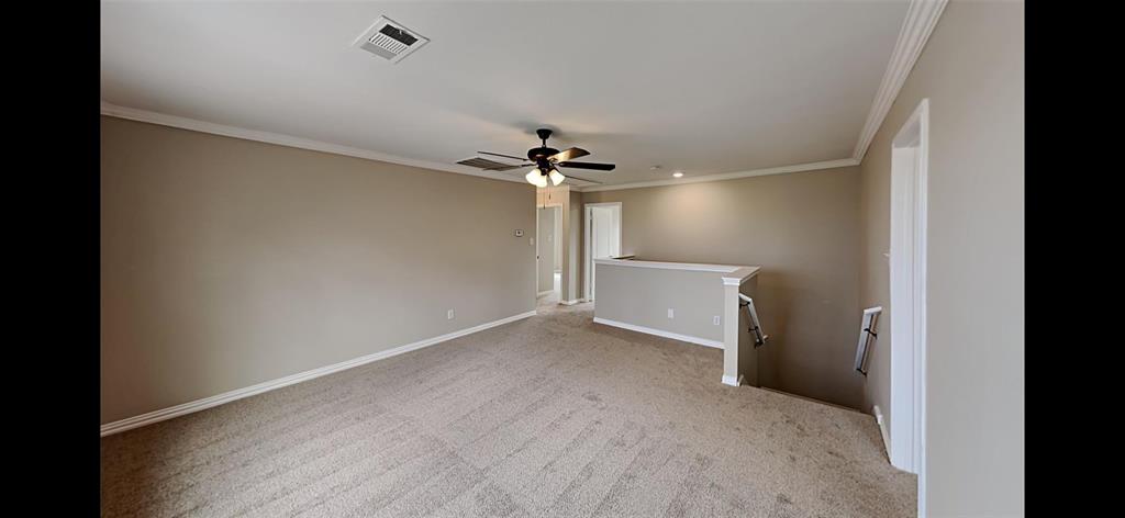 2203 Wagon Wheel Trail Corinth, TX 76208 - Photo 6 of 16 a view of a room with a ceiling fan