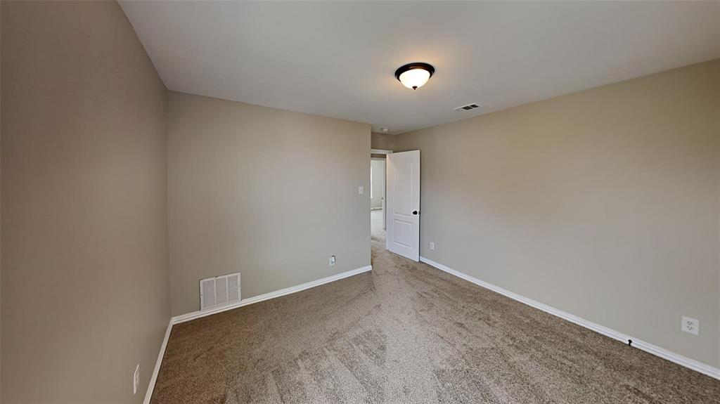 2203 Wagon Wheel Trail Corinth, TX 76208 - Photo 10 of 16 a view of an empty room