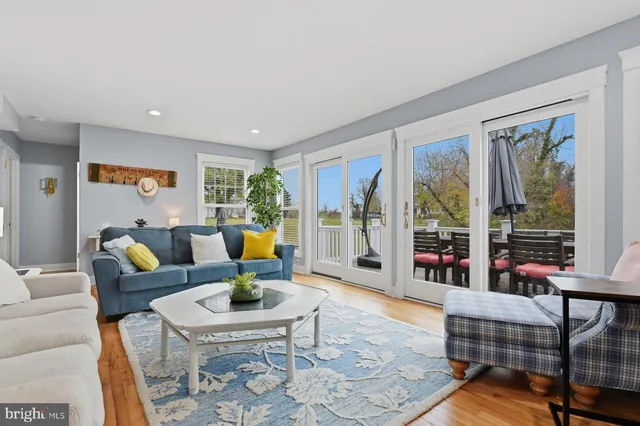 a living room with furniture fireplace and flat screen tv