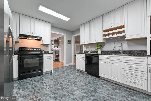 a view of a dining room with furniture and window