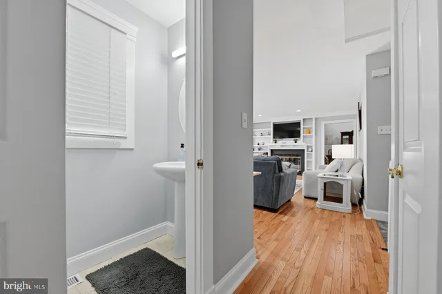 a view of a room with wooden walls and white walls