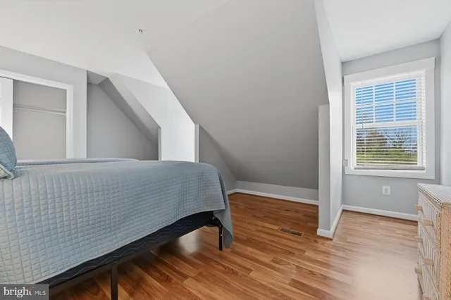 a bed room with a bed and a tv