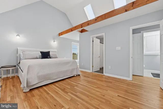 an aerial view of lake residential house with outdoor space and trees around