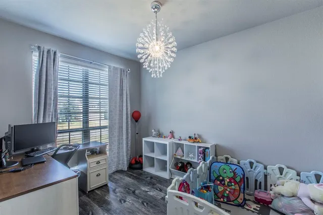 a bedroom with a workspace