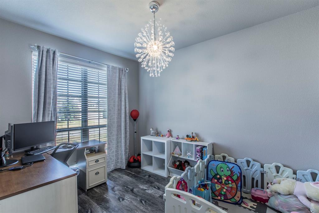 3113 Samson Drive Lorena, TX 76655 - Photo 20 of 25 a bedroom with a workspace
