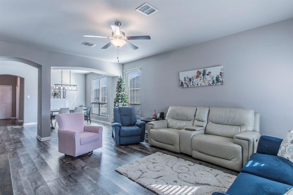 3113 Samson Drive Lorena, TX 76655 - Photo 5 of 25 a living room with furniture and a chandelier
