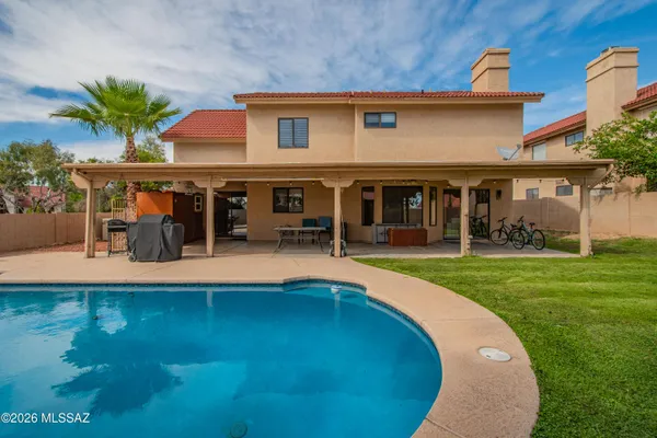 a view of a house with a swimming pool