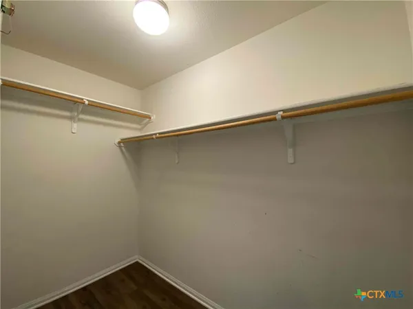 a view of a room with shelf on the wall