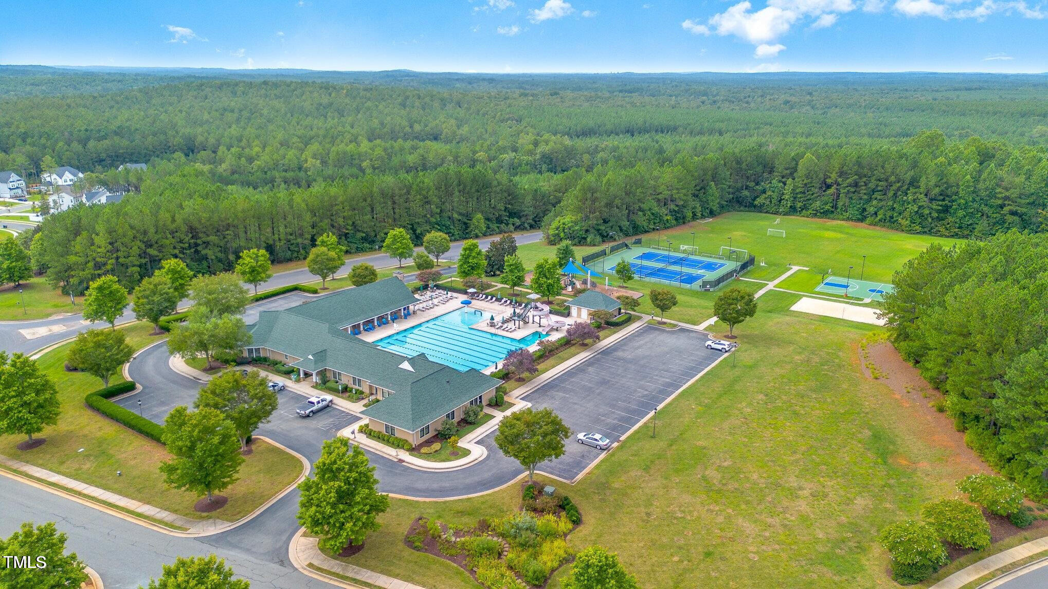 183 Lookout Ridge Pittsboro, NC 27312 - Photo 6 of 8 a view of a swimming pool and lounge chair