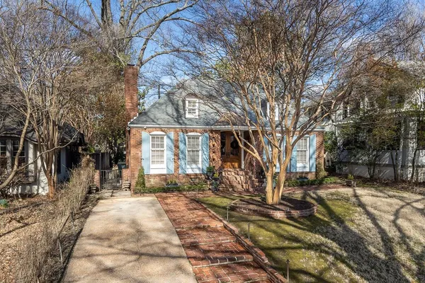 a house with trees in front of it