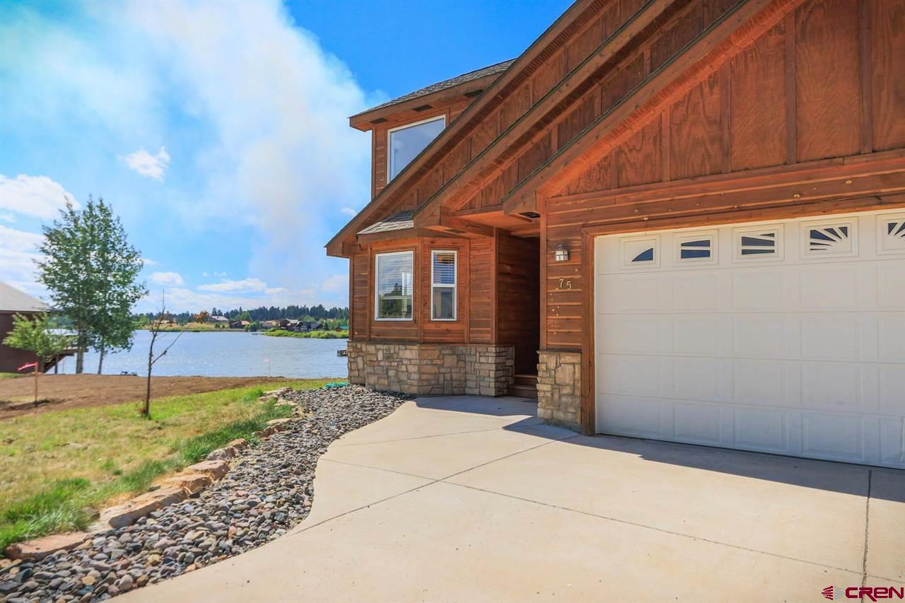 75 Pebble Circle Pagosa Springs, CO 81147 - Photo 2 of 30 a front view of a house with garden