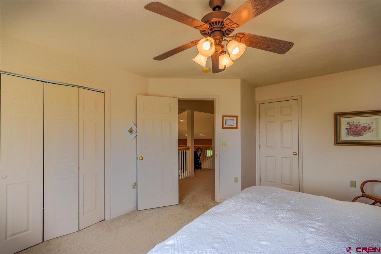 75 Pebble Circle Pagosa Springs, CO 81147 - Photo 22 of 30 a view of a livingroom with a chandelier fan