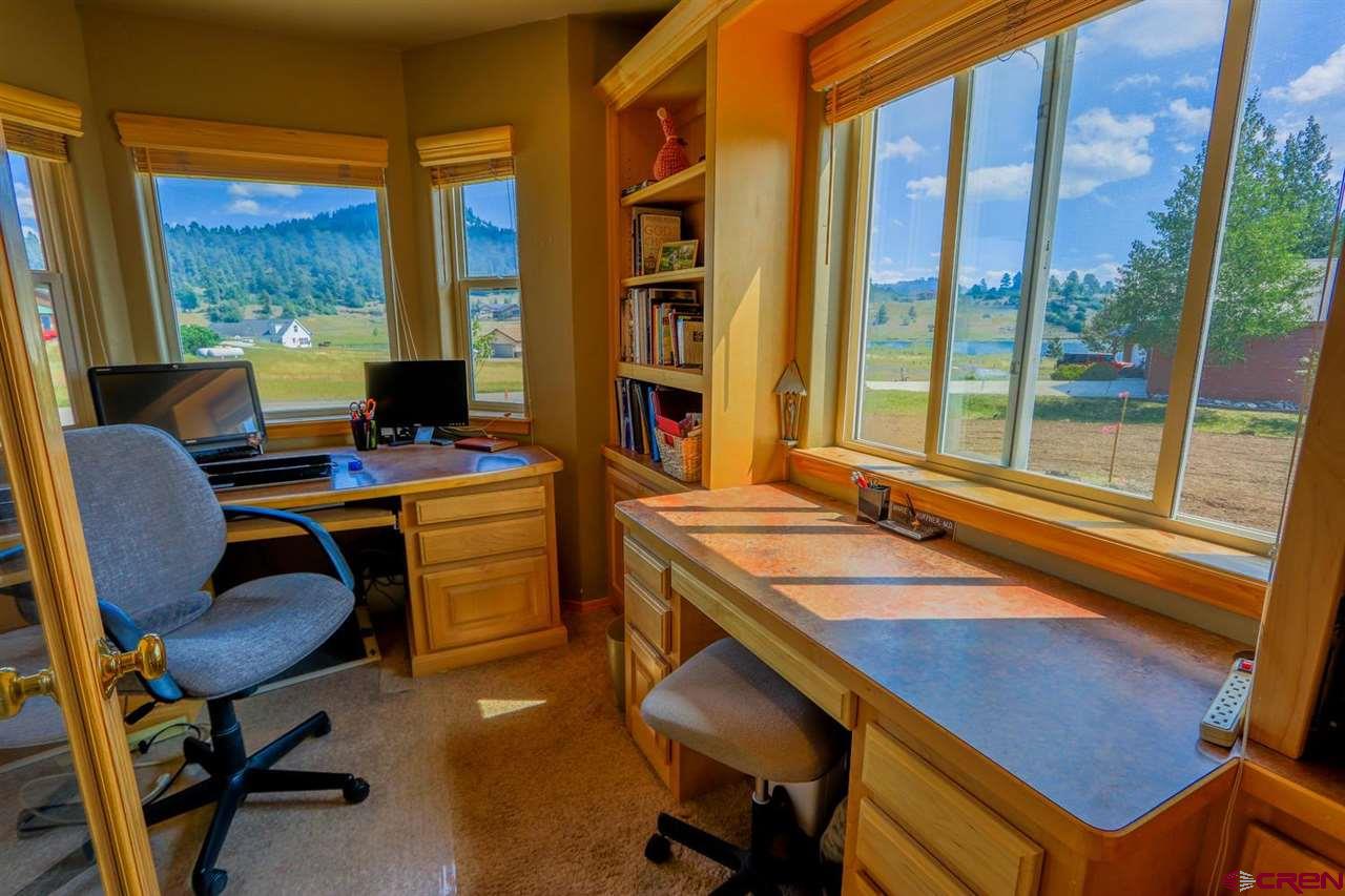 75 Pebble Circle Pagosa Springs, CO 81147 - Photo 26 of 30 a view of a workspace with furniture and a window