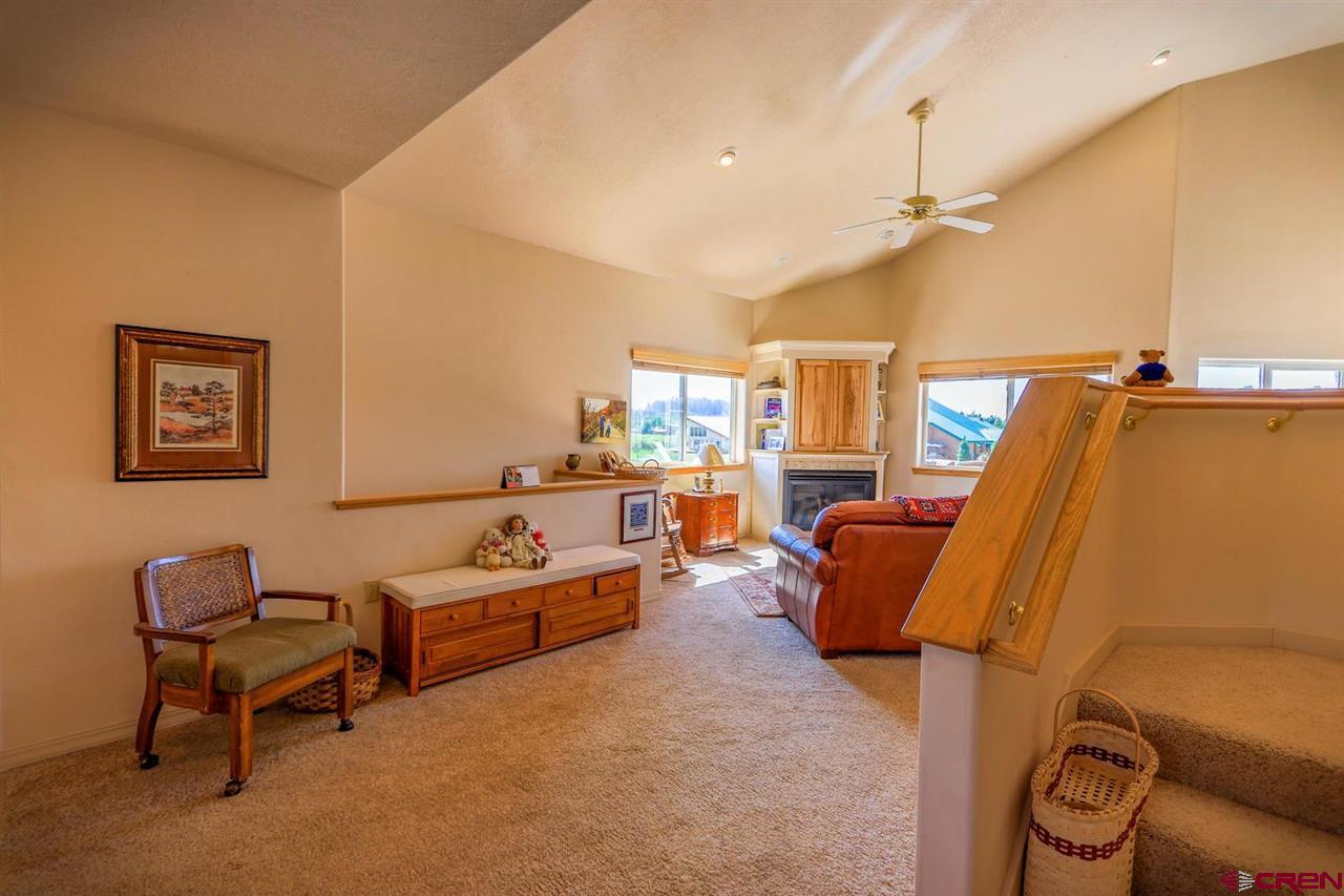 75 Pebble Circle Pagosa Springs, CO 81147 - Photo 4 of 30 a living room with furniture and a flat screen tv