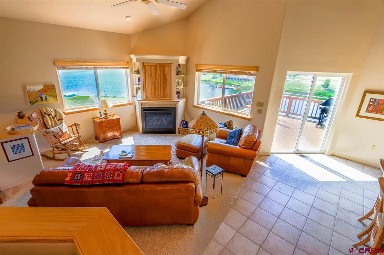 75 Pebble Circle Pagosa Springs, CO 81147 - Photo 9 of 30 a living room with furniture and a floor to ceiling window