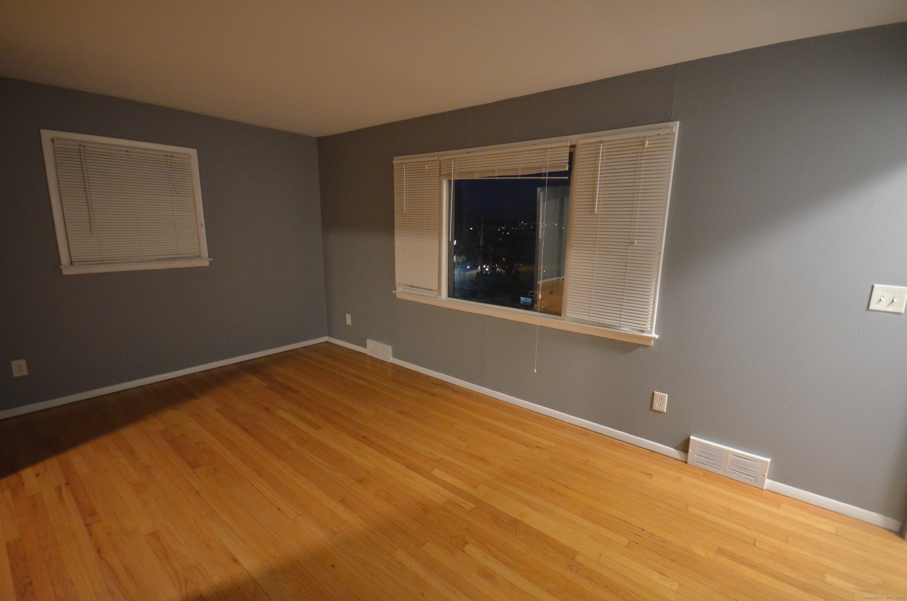 28 Riverside Drive Fairfield, CT 06824 - Photo 2 of 14 a view of an empty room with wooden floor and a window