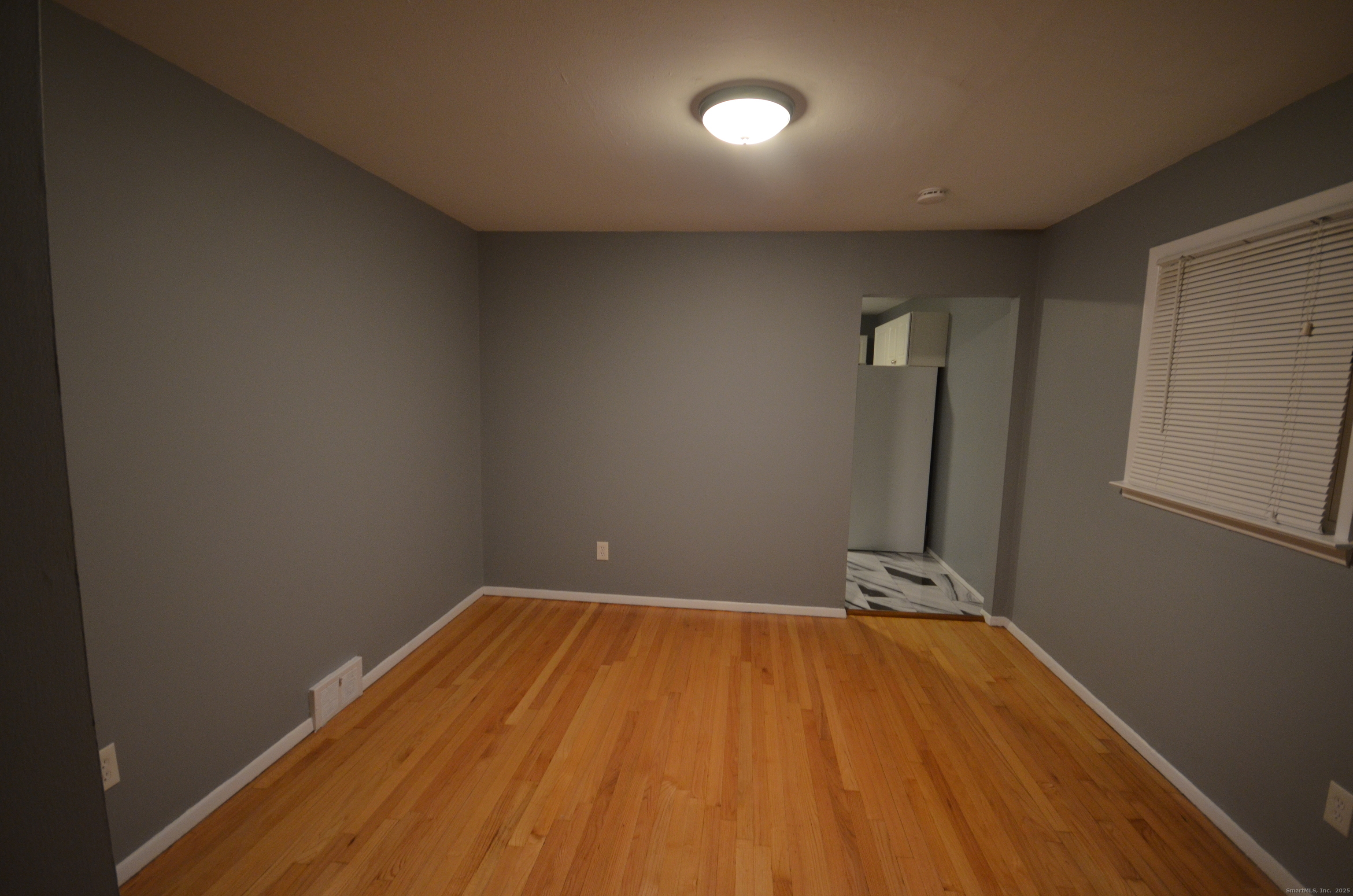 28 Riverside Drive Fairfield, CT 06824 - Photo 4 of 14 a view of a room with wooden floor