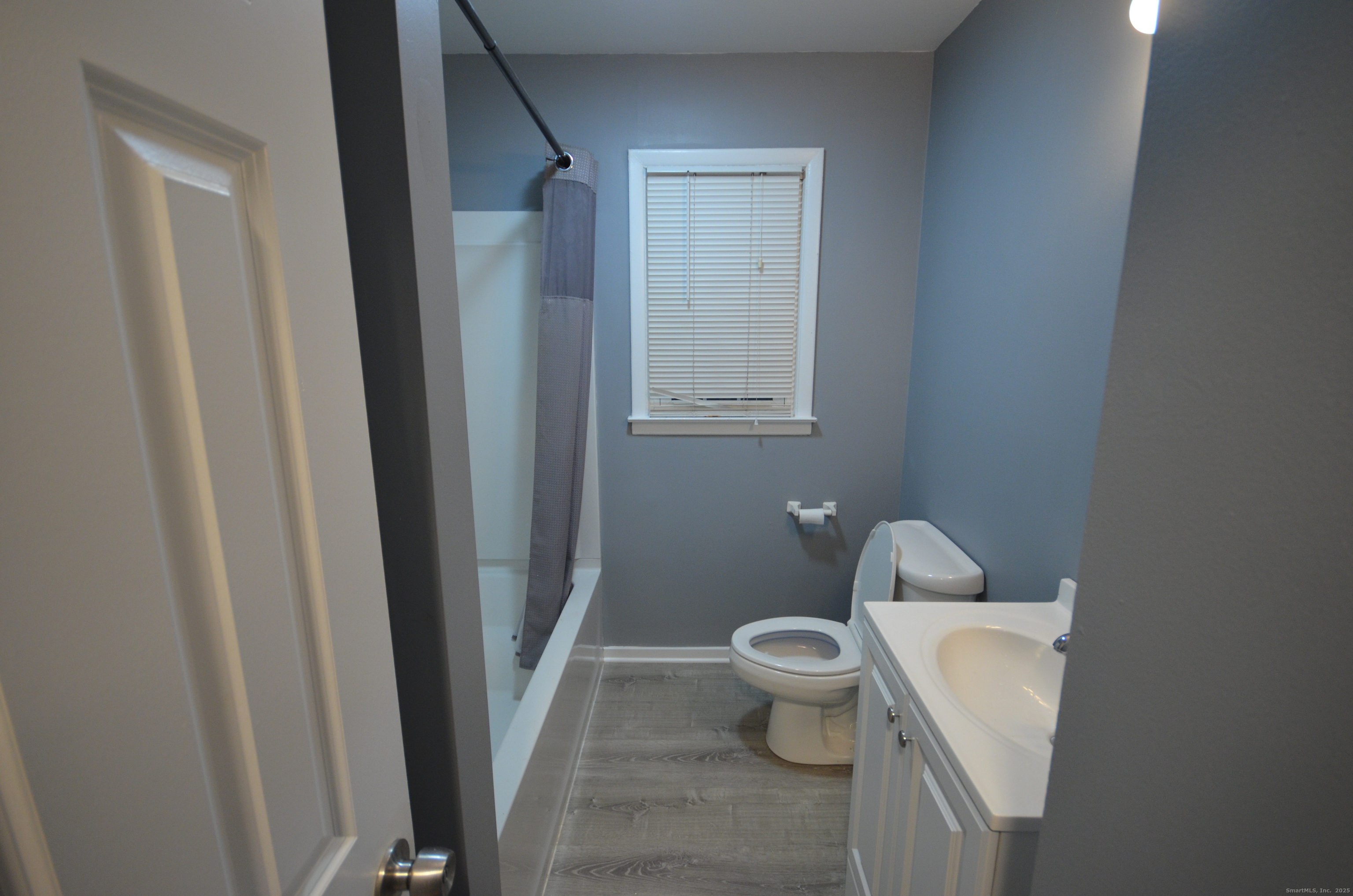 28 Riverside Drive Fairfield, CT 06824 - Photo 7 of 14 a white toilet sitting next to a shower