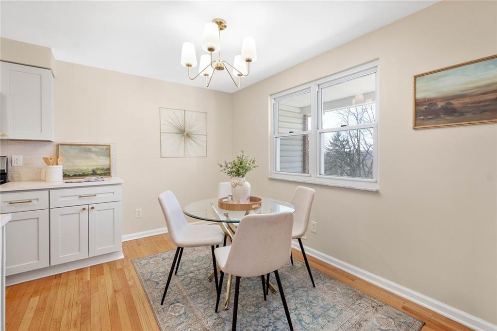 402 Forest Ridge Drive Pittsburgh, PA 15221 - Photo 16 of 35 a dining room with furniture and window