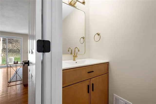 a bathroom with a sink and mirror
