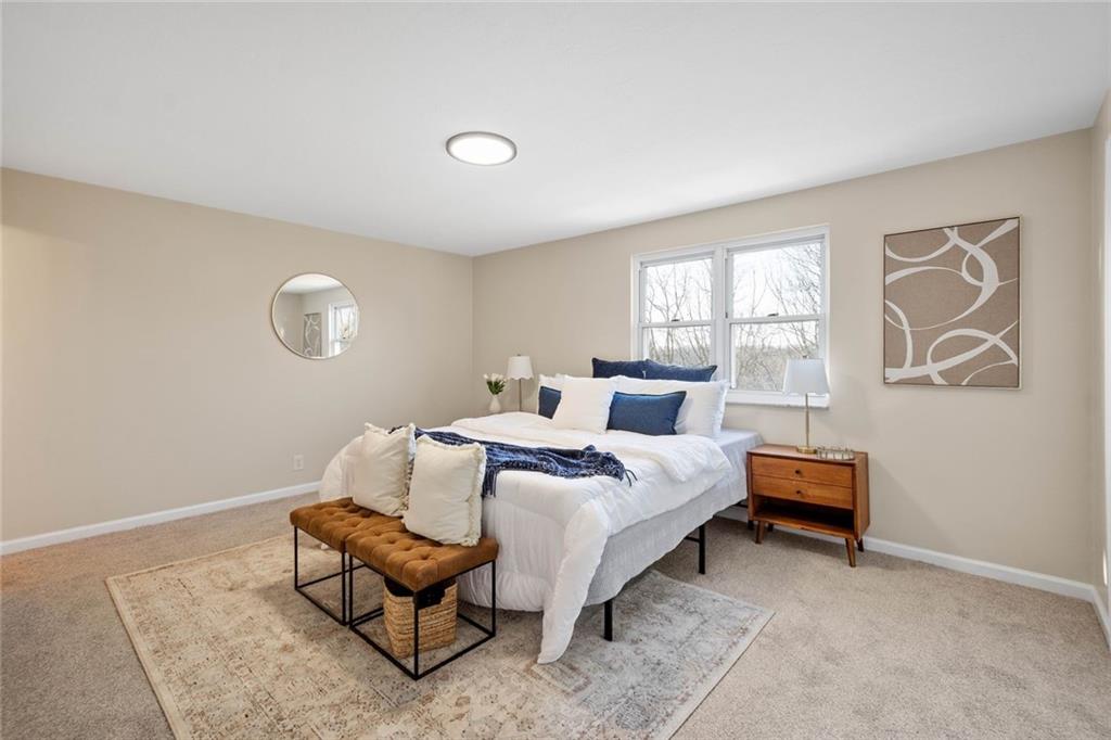 402 Forest Ridge Drive Pittsburgh, PA 15221 - Photo 19 of 35 a bedroom with a bed and a couch