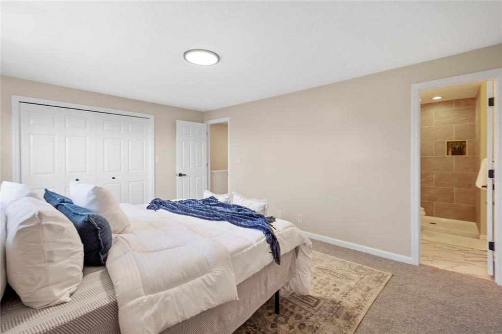 402 Forest Ridge Drive Pittsburgh, PA 15221 - Photo 20 of 35 a bedroom with a bed and with the bathroom