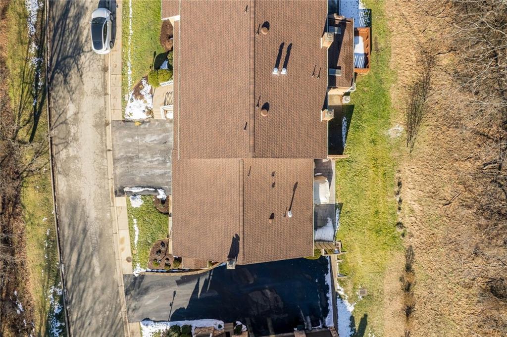 402 Forest Ridge Drive Pittsburgh, PA 15221 - Photo 33 of 35 view of a bathroom with a potted plant and a shower