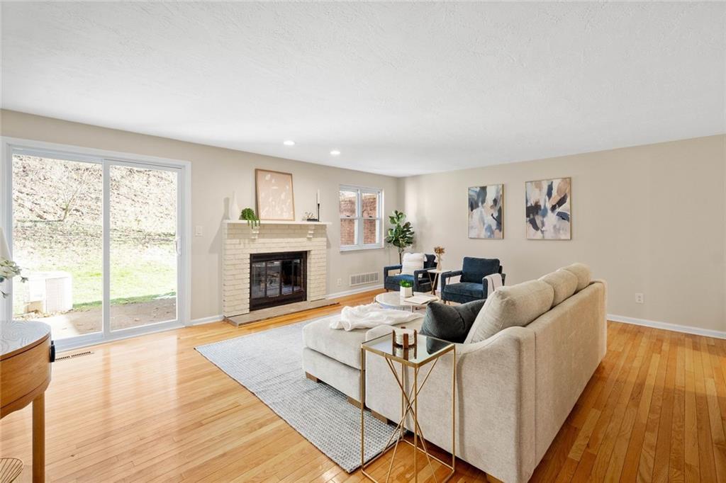 402 Forest Ridge Drive Pittsburgh, PA 15221 - Photo 4 of 35 a living room with furniture and a fireplace
