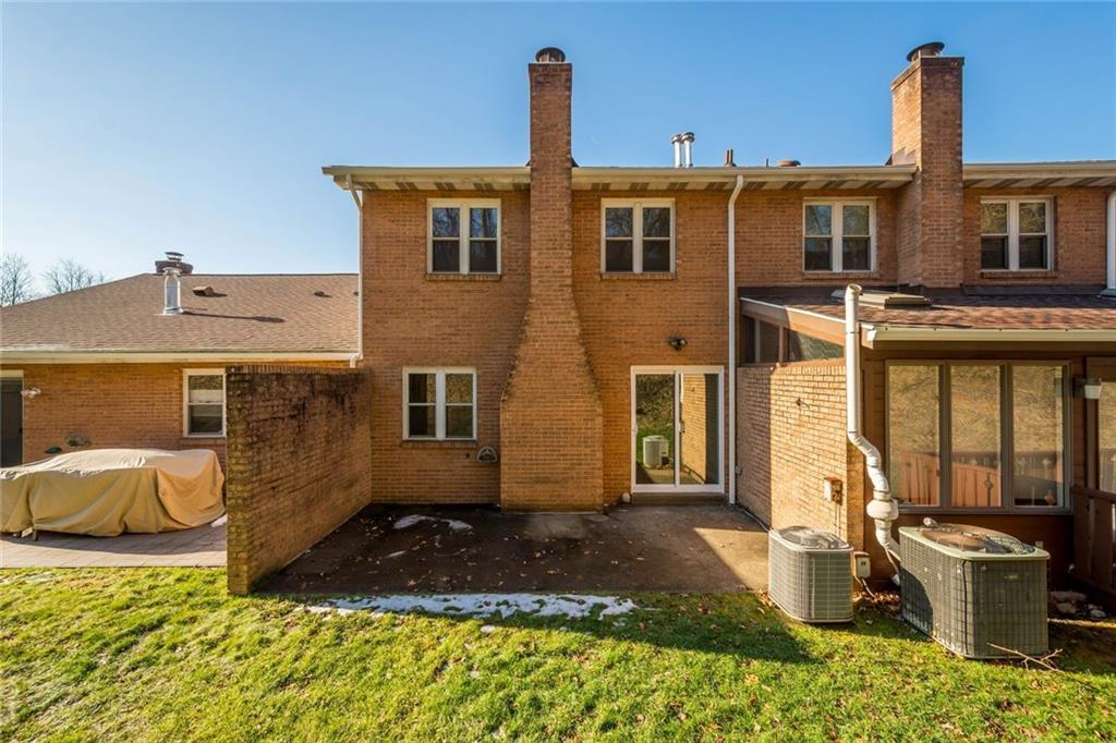 402 Forest Ridge Drive Pittsburgh, PA 15221 - Photo 6 of 35 a front view of a house with a yard