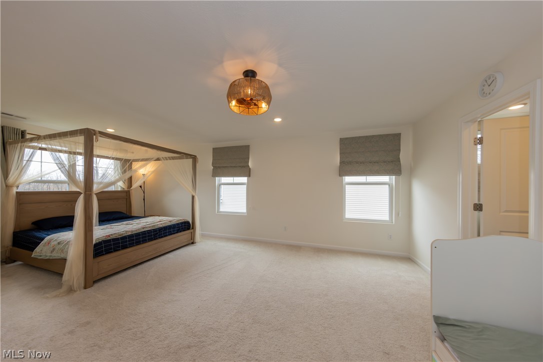 766 River Run Road Aurora, OH 44202 - Photo 34 of 49 Primary Bedroom featuring recessed lighting and light carpet