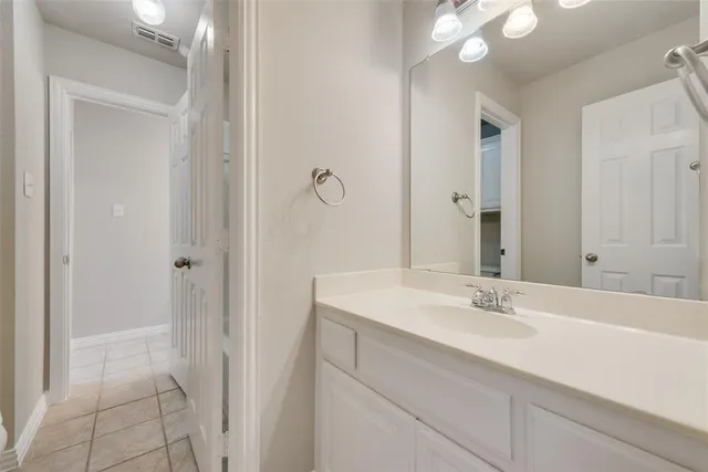 a bathroom with a sink double vanity and a mirror
