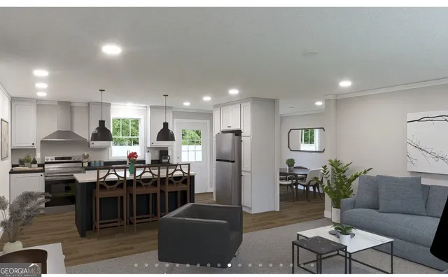 a kitchen with stainless steel appliances granite countertop a stove top oven a sink a dining table and chairs with wooden floor