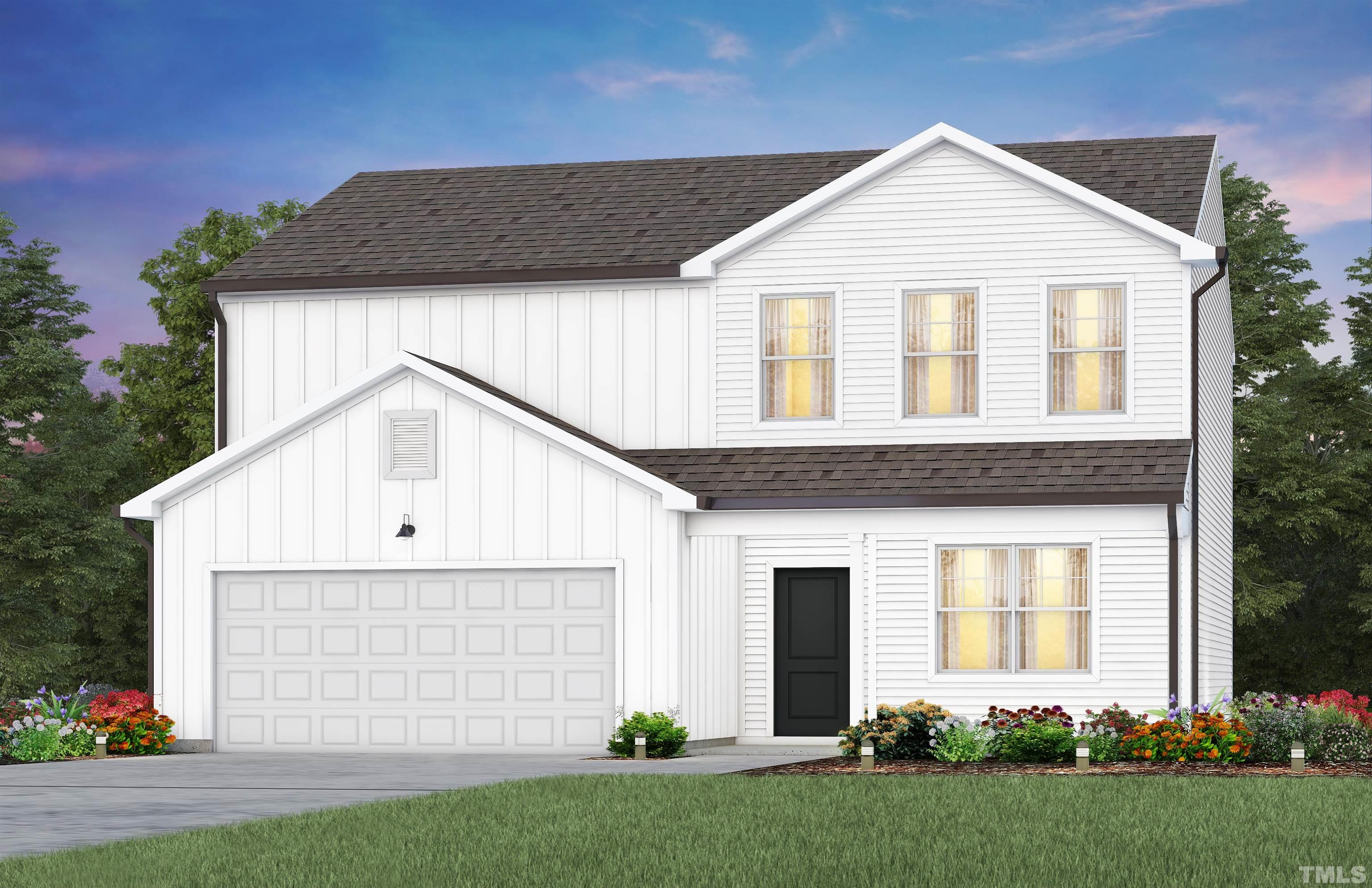 a front view of a house with a garden and plants