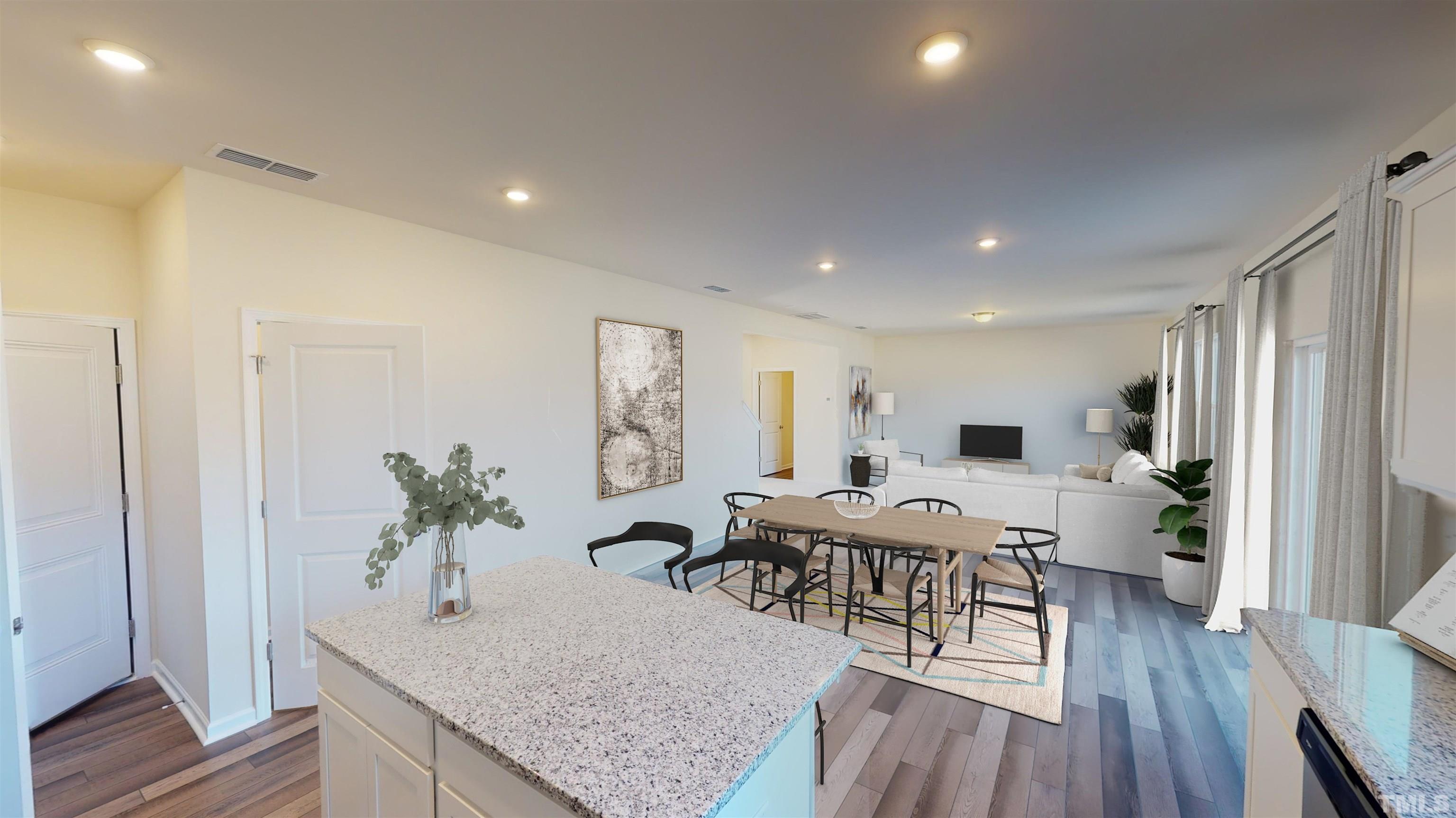 3429 Dragonfly River Raleigh, NC 27604 - Photo 15 of 27 a living room with furniture a potted plant and open kitchen view
